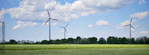 Tableau sur toile Field and metal windmills to generate electricity in Austria