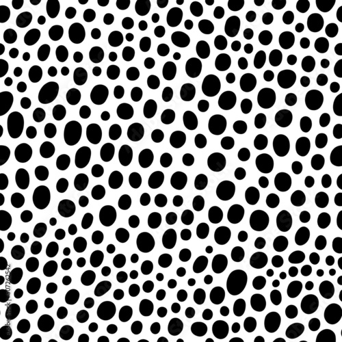 Vector animal pattern with spots. Monochrome seamless pattern with random dense dots. Black and white doodle texture.