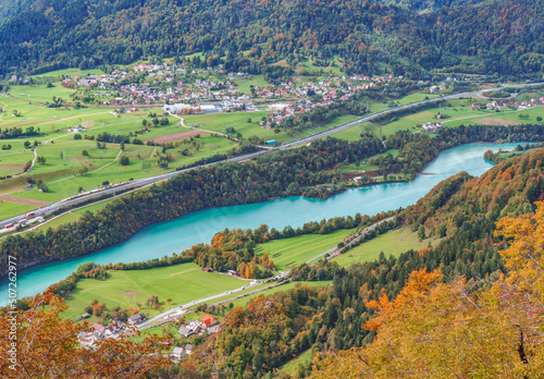 Autumn view of the valley, hills, river and mountains