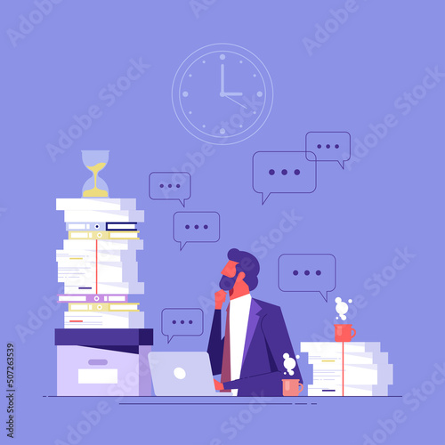 Business deadline and overwork concept. Stressed young businessman worker sitting in office at laptop with heap of papers looking at sand glass