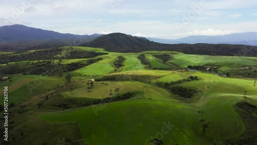 Hills with green grass and pastures in the mountain province. Ambewela, Nuwara Eliya, Sri Lanka. photo