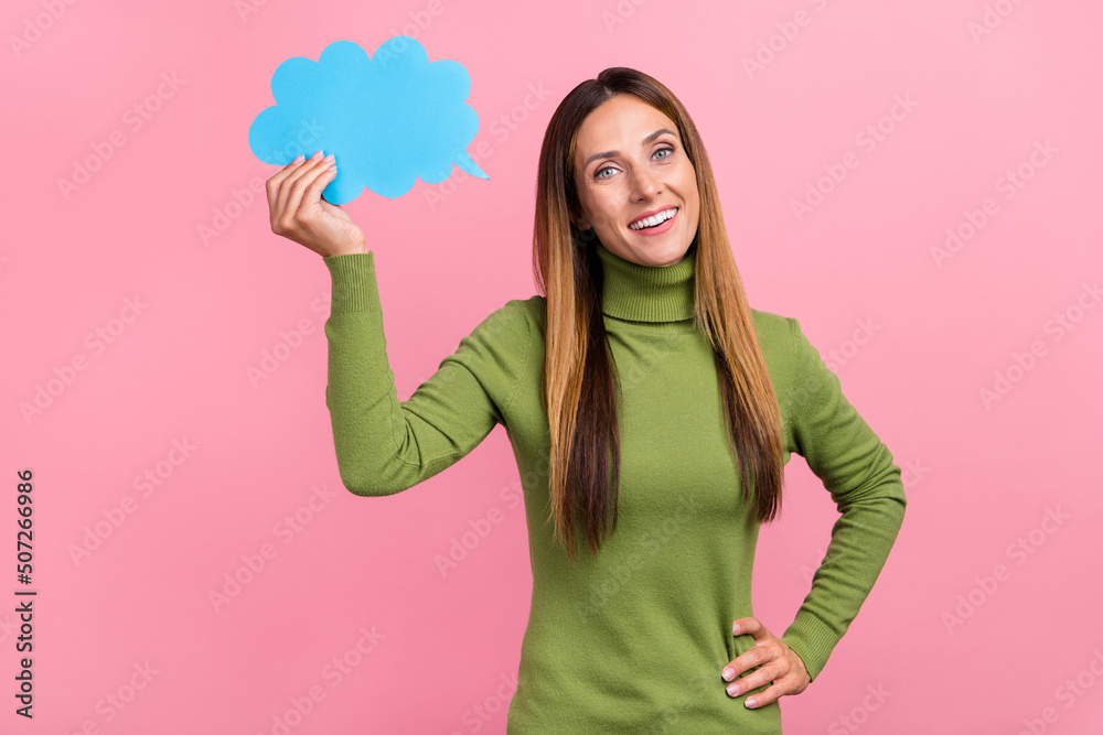 Photo of lovely pretty lady hold paper speech cloud banner thinking decision solution isolated pastel color background Photo of lovely pretty lady hold paper speech cloud banner thinking decision solution isolated pastel color background