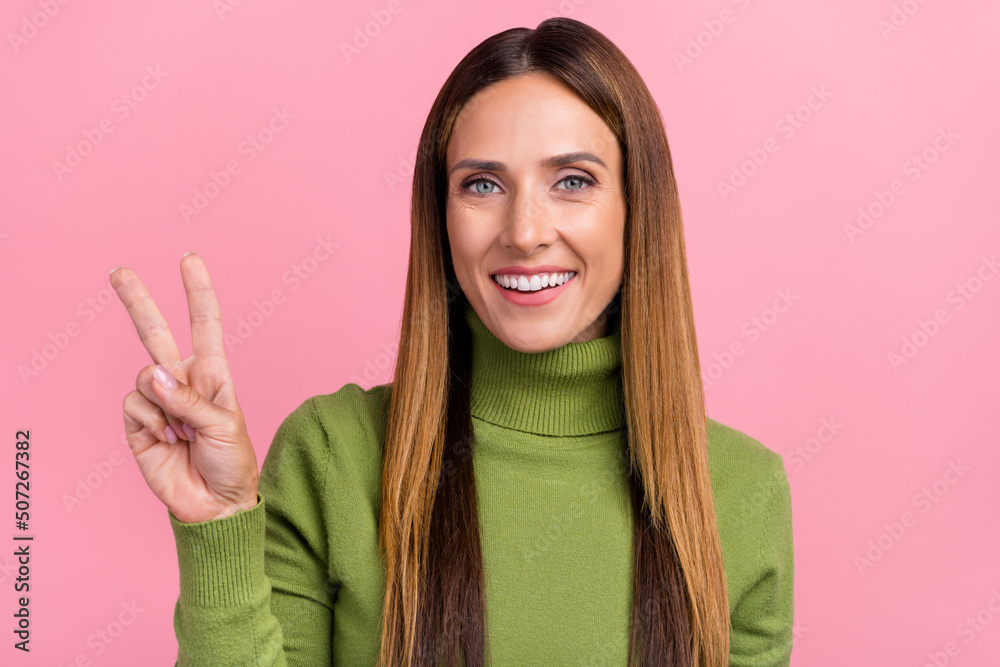 Portrait of nice sweet lady enjoying weekend greet friend make v sign isolated on pastel color background Portrait of nice sweet lady enjoying weekend greet friend make v sign isolated on pastel color background