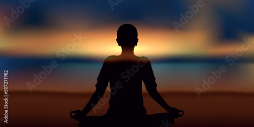 Canvas-taulu mediating person on the beach at sunset
