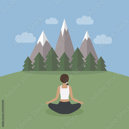 girl makes yoga on green mountain landscape