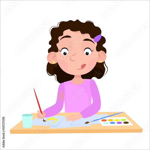 Curly-haired girl draws with paints at the table