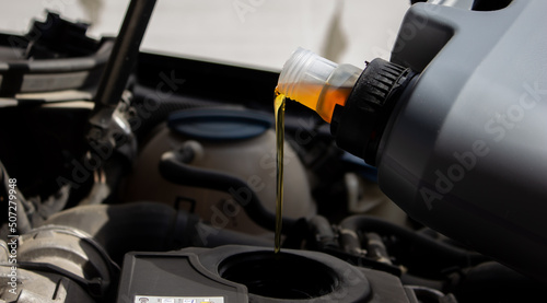 Refueling and pouring oil quality into the engine motor car Transmission and Maintenance Gear .