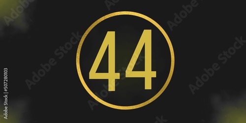 Number 44. Banner with the number forty on a black background and gold details with a circle gold in the middle photo