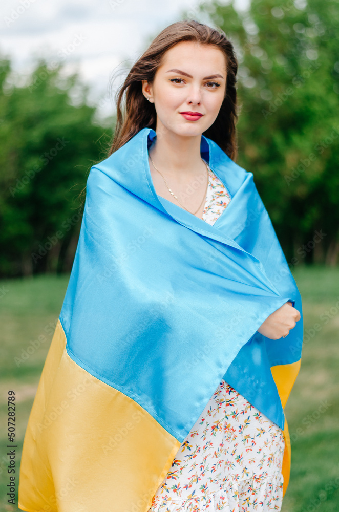patriotic photo of a Ukrainian woman with the flag of Ukraine patriotic photo of a Ukrainian woman with the flag of Ukraine