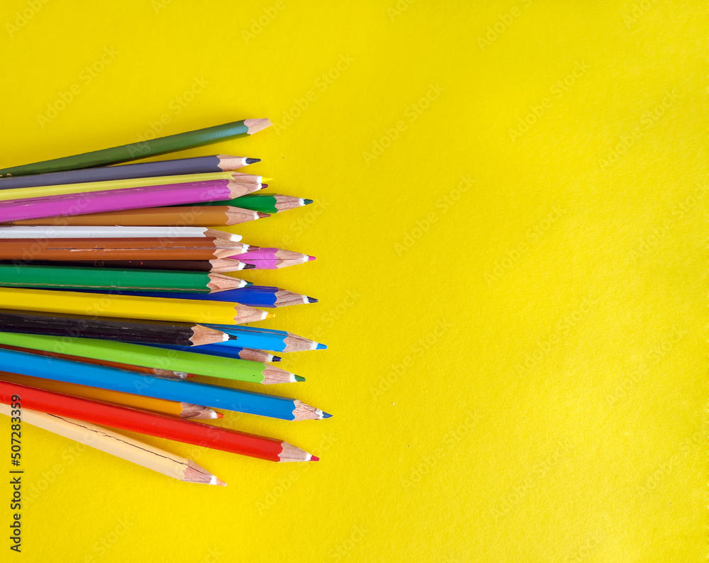Yellow pencils with copy space on yellow background Yellow pencils with copy space on yellow background
