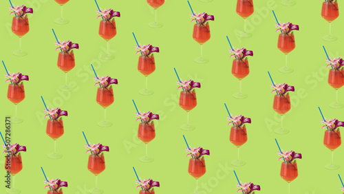 Canvas Print Summer creative pattern with cocktail glasses, drinking straw, and flowers on a pastel green background