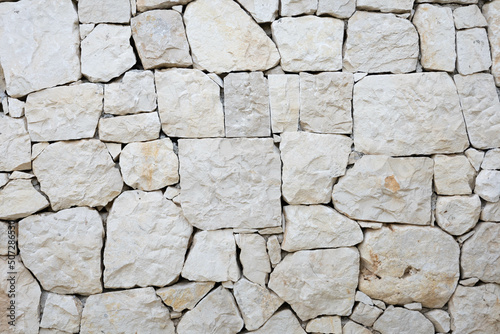 Grey and brown stones wall construction
