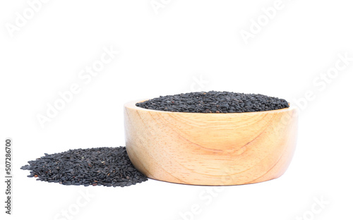 poppy seeds in a wooden bowl isolated on white background