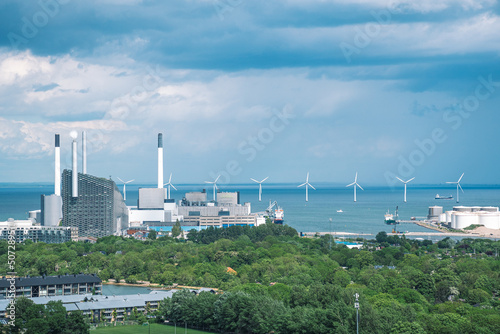 Areal view of Amager Bakke, Slope or Copenhill, incineration plant, heat and power waste-to-energy plant and offshore wind turbines power in the Baltic Sea photo