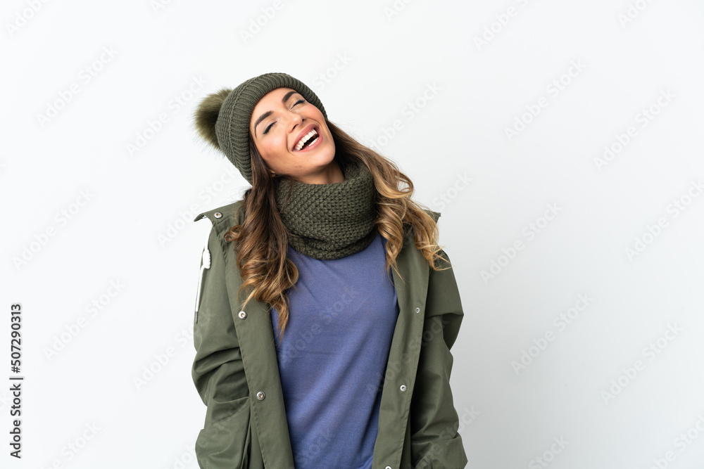 Young girl with winter hat isolated on white background laughing Young girl with winter hat isolated on white background laughing
