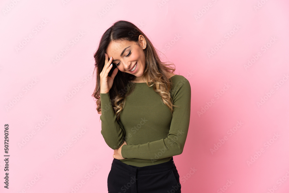 Young caucasian woman isolated on pink background laughing Young caucasian woman isolated on pink background laughing