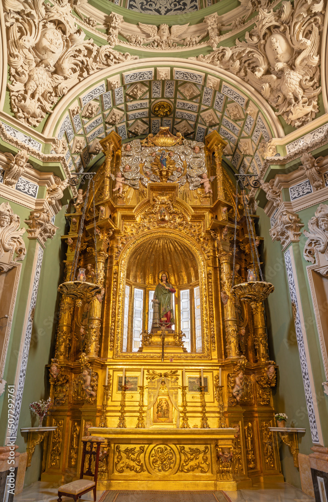 VALENCIA, SPAIN - FEBRUAR 17, 2022: The baroque altar of St. Barbara chapel in church Iglesia San Juan de Ospital designed by Juan B. Perez Castiel (1686).