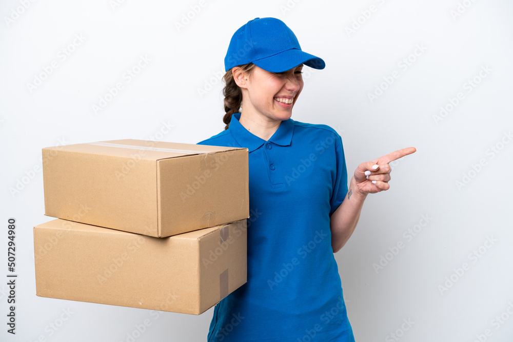 Delivery caucasian woman isolated on white background pointing finger to the side and presenting a product Delivery caucasian woman isolated on white background pointing finger to the side and presenting a product