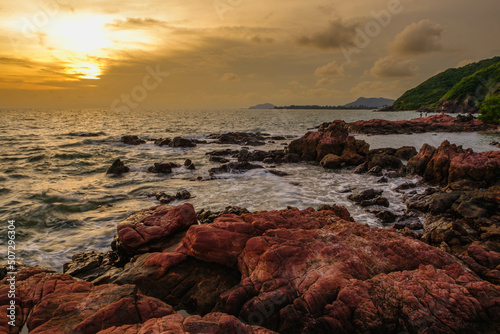 A beautiful landscape of water, rocks and stones at sunset pink stone Rayong Thailand