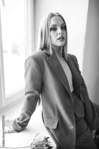 Blondie beauty woman close up portrait. Beautiful professional model posing in studio