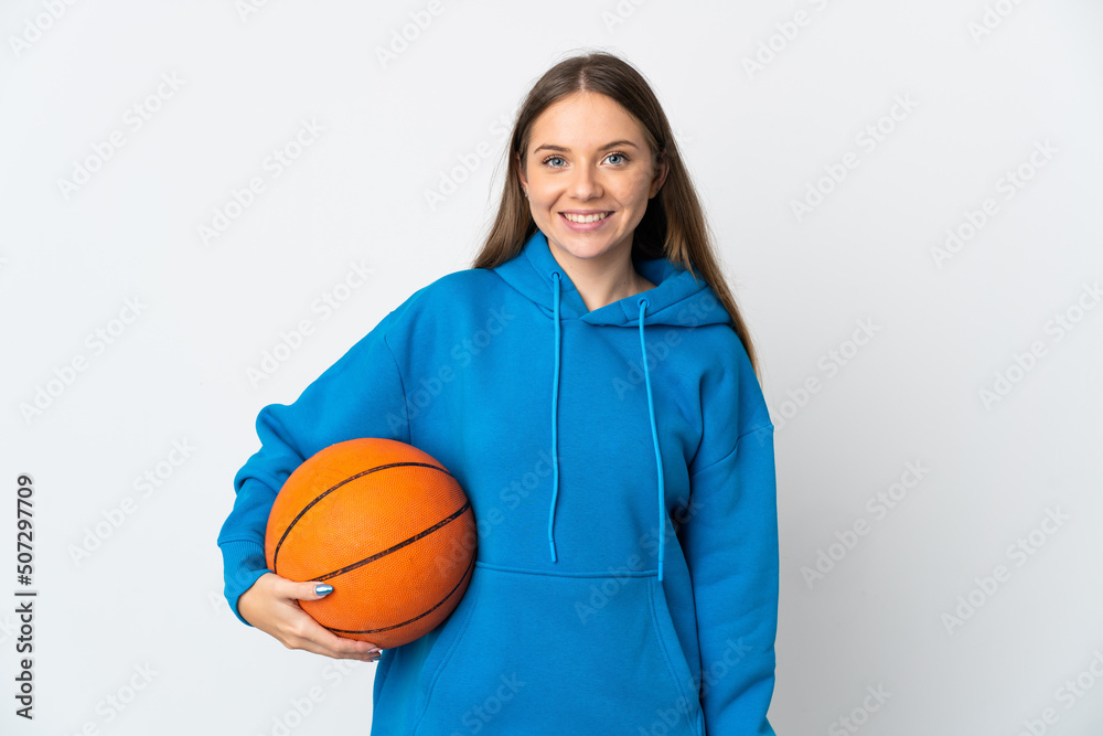 Young Lithuanian woman isolated on white background playing basketball