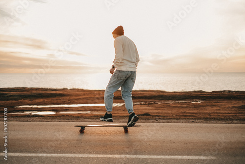 man on longboard photo