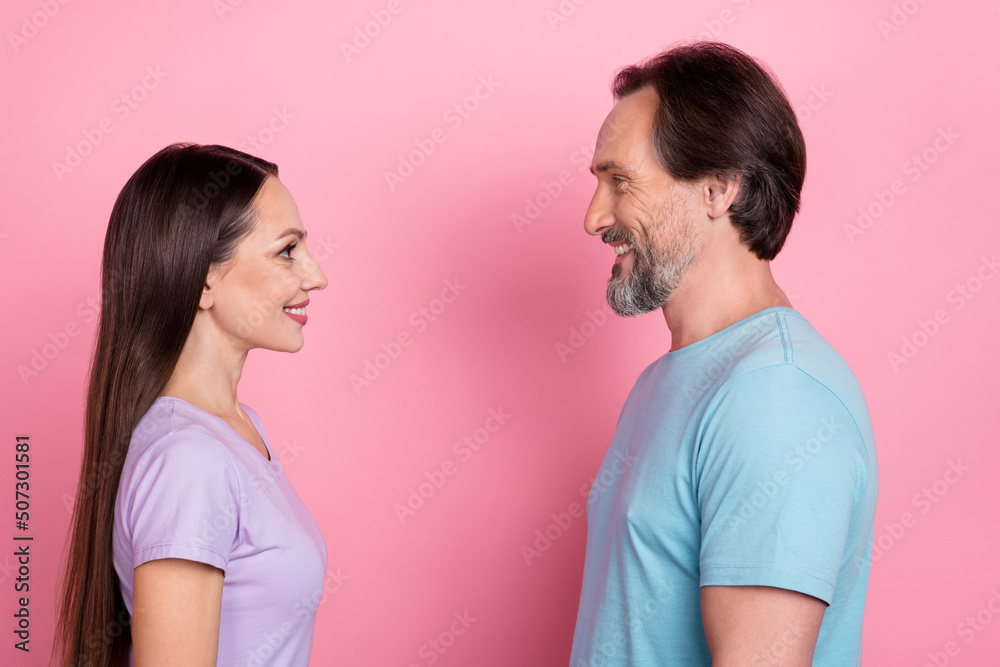 Profile photo of two peaceful positive partners toothy smile look eyes isolated on pink color background Profile photo of two peaceful positive partners toothy smile look eyes isolated on pink color background