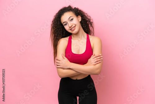 Young Sport Arab woman isolated on pink background