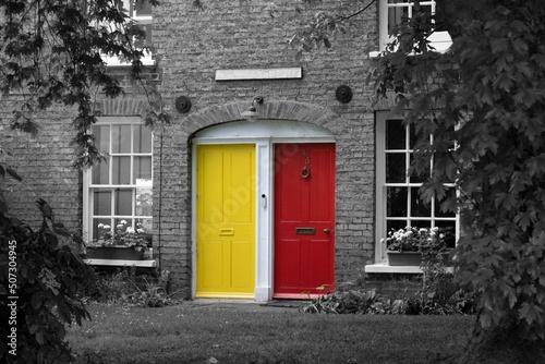 Photography English House With Yellow and Red doors on black and white background
