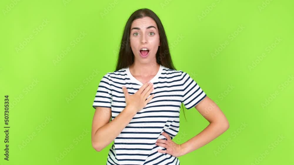 Young brunette woman gaping because have just surprised with a gift over isolated background. Green screen chroma key Young brunette woman gaping because have just surprised with a gift over isolated background. Green screen chroma key