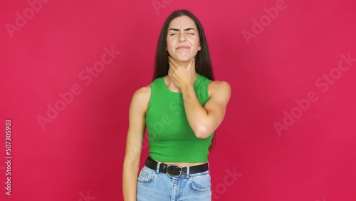 Young brunette woman with sore throat over isolated background