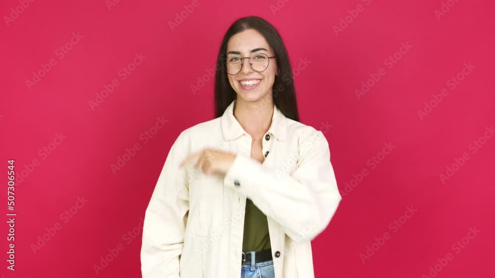 Young brunette woman with glasses and pointing side Young brunette woman with glasses and pointing side