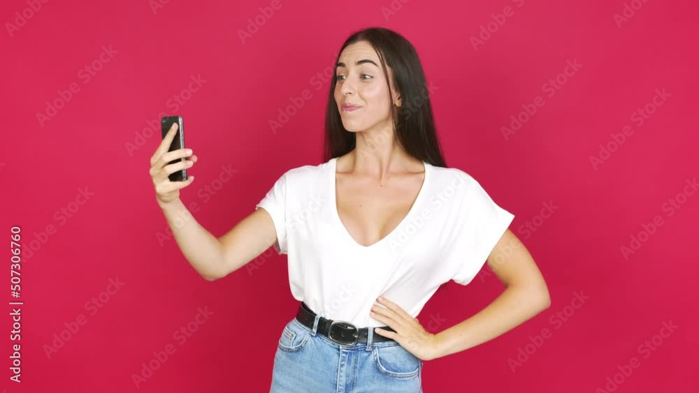 Young brunette woman having a video conference over isolated background Young brunette woman having a video conference over isolated background