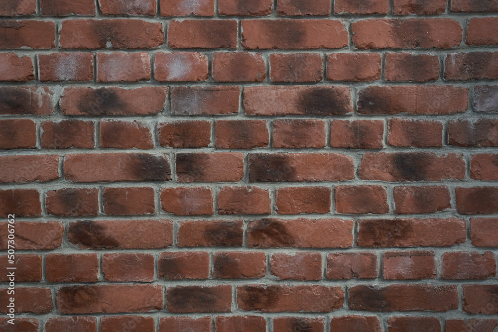 An old brick wall with weather spots.Red brick wall texture grunge background for interior design. High quality photo An old brick wall with weather spots.Red brick wall texture grunge background for interior design. High quality photo