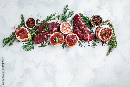 Schilderij op canvas Raw beef filet Mignon steak on with pepper and salt, filet mignon
