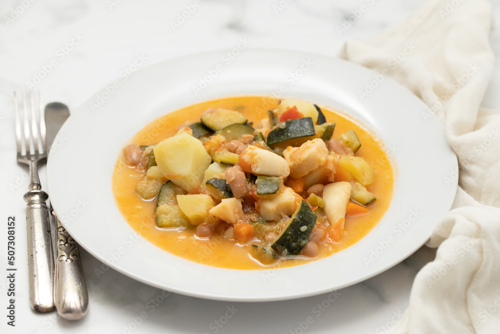 squid with with vegetables and sauce on the plate squid with with vegetables and sauce on the plate
