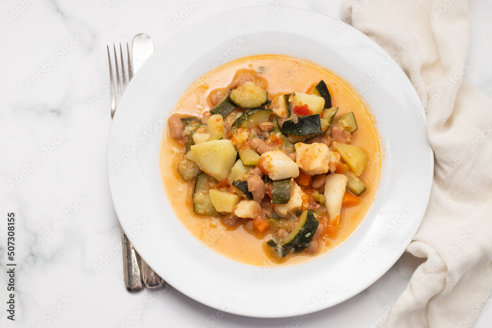 squid with with vegetables and sauce on the plate squid with with vegetables and sauce on the plate