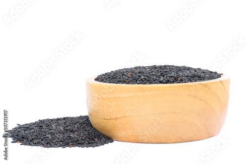 poppy seeds in a wooden bowl isolated on white background