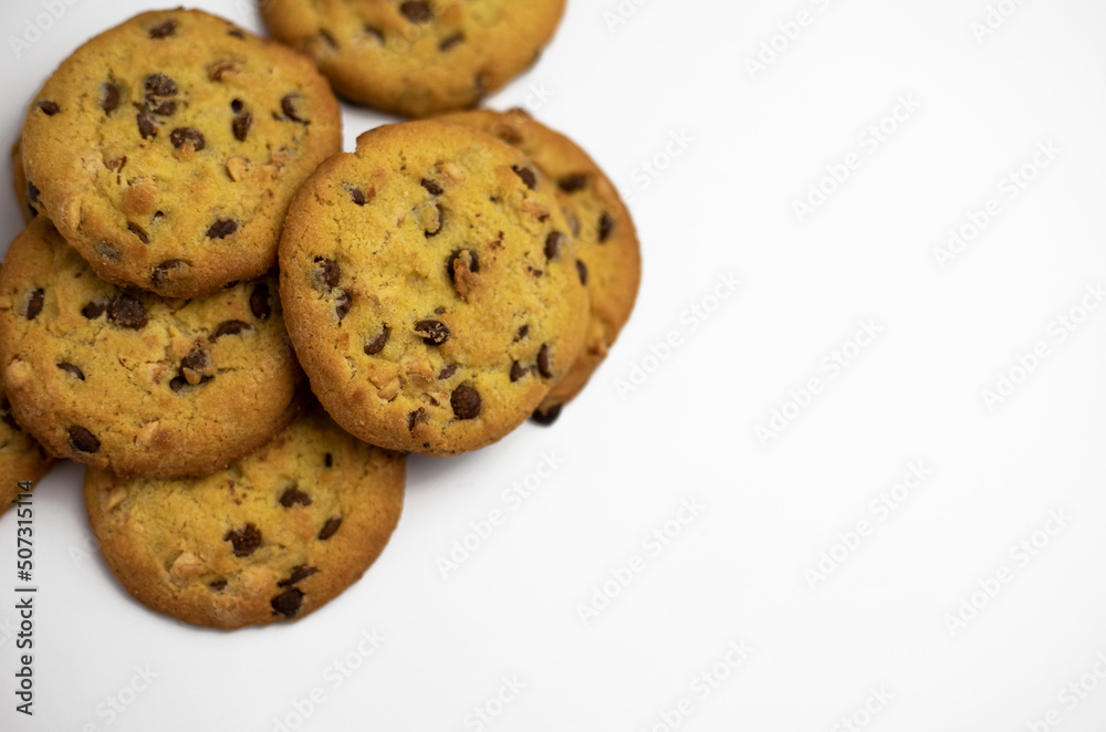 Cookies with pieces of chocolate on a white background
