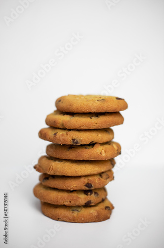 The cookie tower. A stack of chocolate chip cookies on a white background