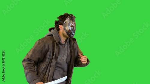 Chasing victim: scary maniac run after scared person Serial killer with knife in mask want to kill on a Green Screen, Chroma Key.