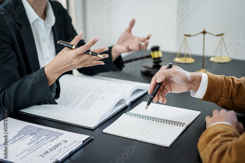 Fototapet Male lawyer or notary working consulting and discussion to businesswoman client