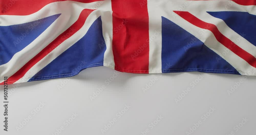 Video of creased flag of great britain lying on white background Video of creased flag of great britain lying on white background