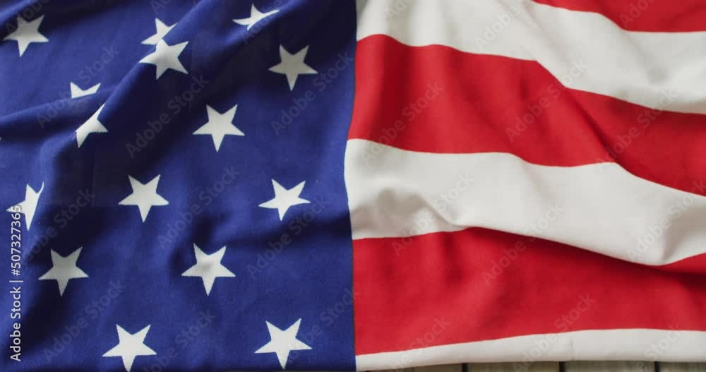 Video of flag of usa lying on wooden background Video of flag of usa lying on wooden background