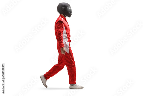 Full length profile shot of a racer in a red suit and black helmet walking © Ljupco Smokovski