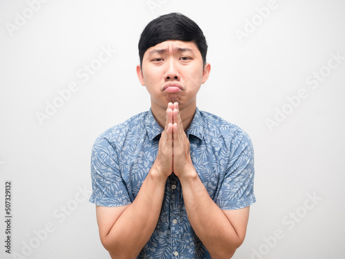 Asian man blue shirt gesture respect hand need help please