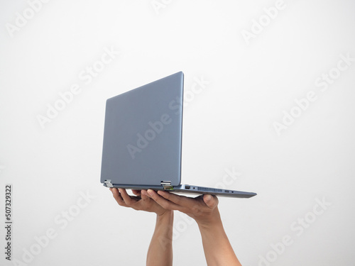 Side view hand holding laptop isolated white