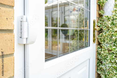 Cuadro en lienzo Shallow focus of door hinges seen on a newly installed double glazed PVC door which leads to a kitchen