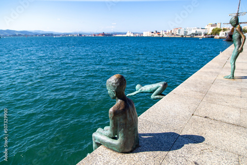 Escultura de Los Raqueros en el puerto de Santander. Cantabria, España. photo