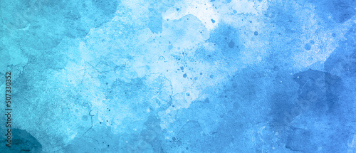 Blue background with grunge texture, watercolor painted mottled blue background, colorful bright ink and watercolor textures on white paper background.